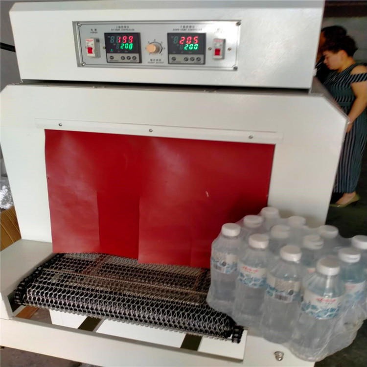 青岛特产原浆啤酒收缩机，5038型滚筒式收缩包装机，PVC膜矿泉水捆扎包装机图片