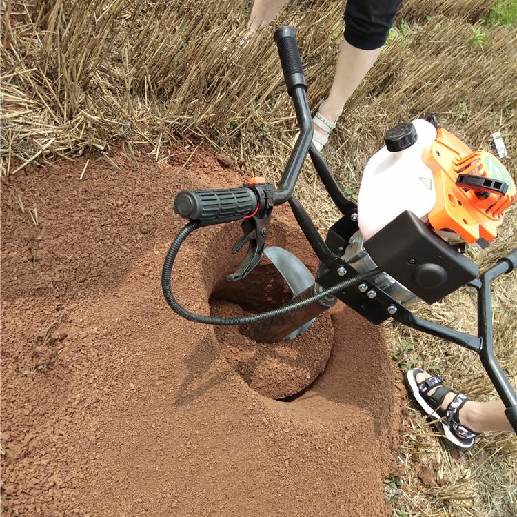 手提植树钻土机好操作   四脚架挖坑机安全好用  汽油机钻坑栽杆利器图片